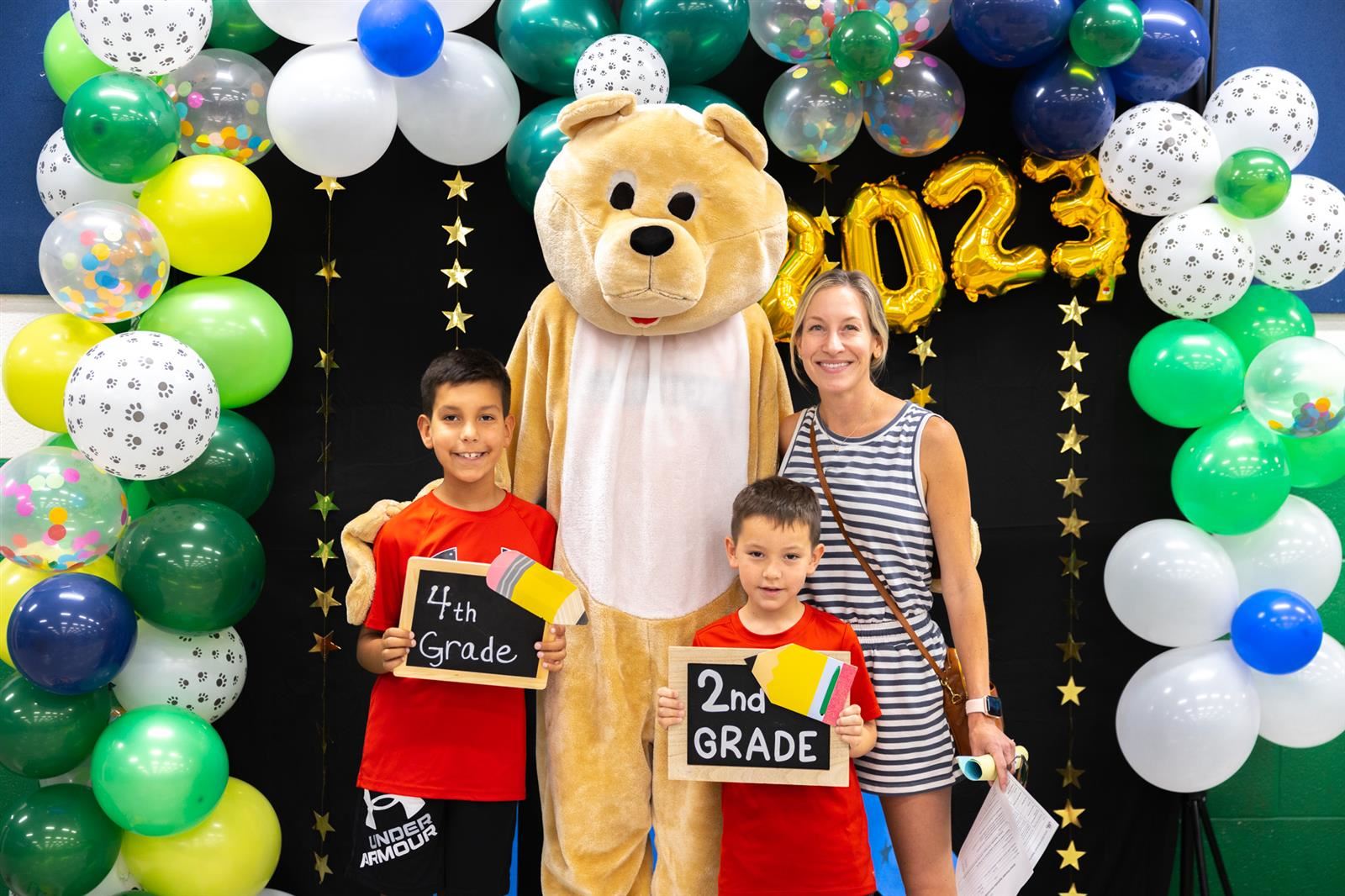 family with LES bear mascot